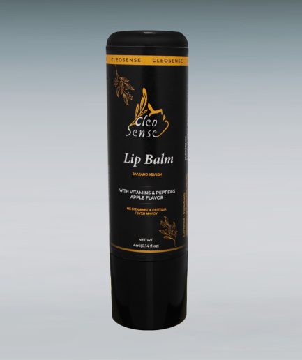 a black and gold tube of lip balm